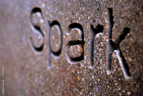 Close up of some engraved writing on a stone wall