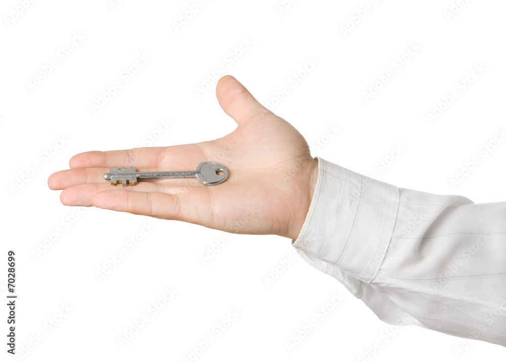 Businessman hand, holding key isolated Businessman hand, holding key isolated