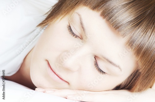 Beautiful woman in white sleeping 