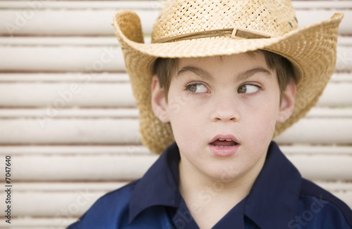 Boy Wearing a Cowboy Hat Looks Left