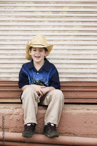 Smiling Boy Wearing a Cowboy hat © Scott Griessel