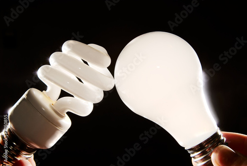 cfl and incandescent lightbulbs on black