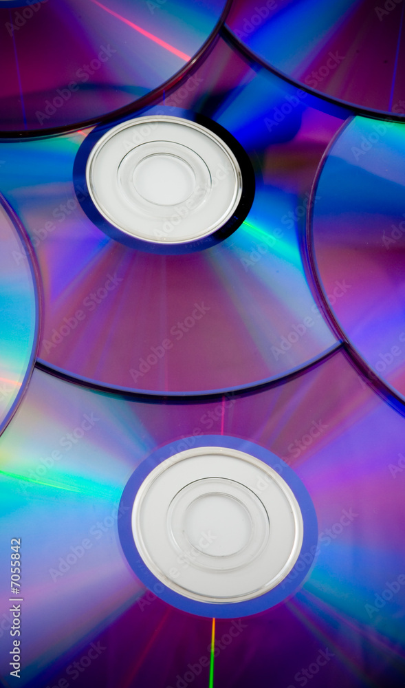 background of some colorful compact discs background of some colorful compact discs
