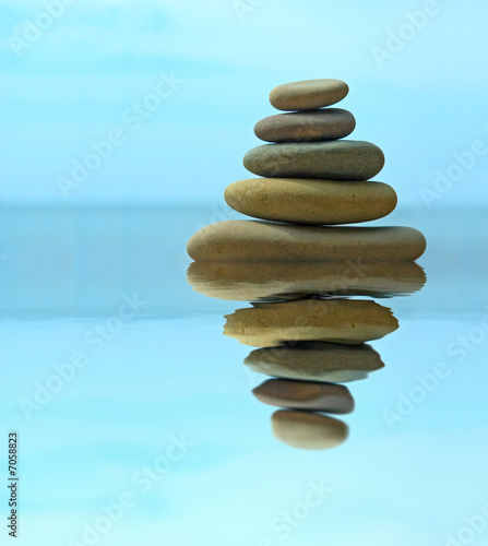 Pebble stack reflecting in the water