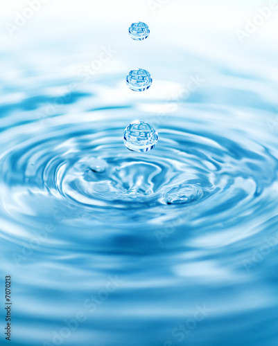 Droplets falling in blue water