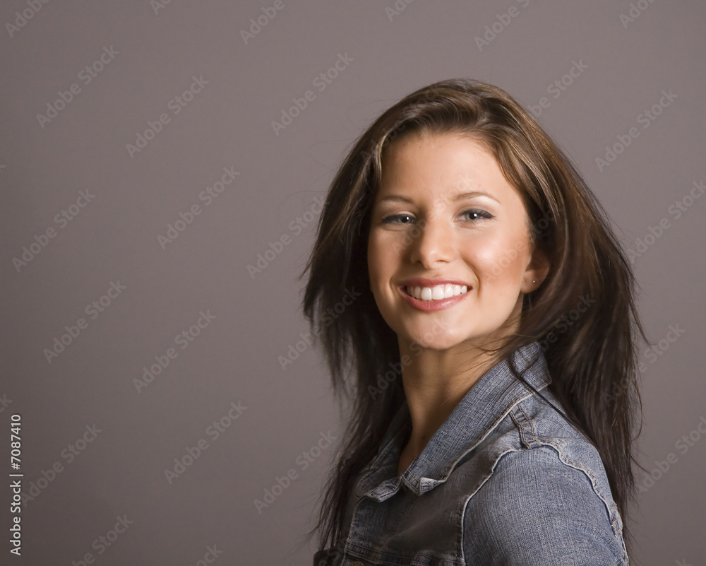 Fototapeta premium Brunette in Denim Flipping Hair