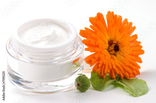 Face cream and calendula flower photo