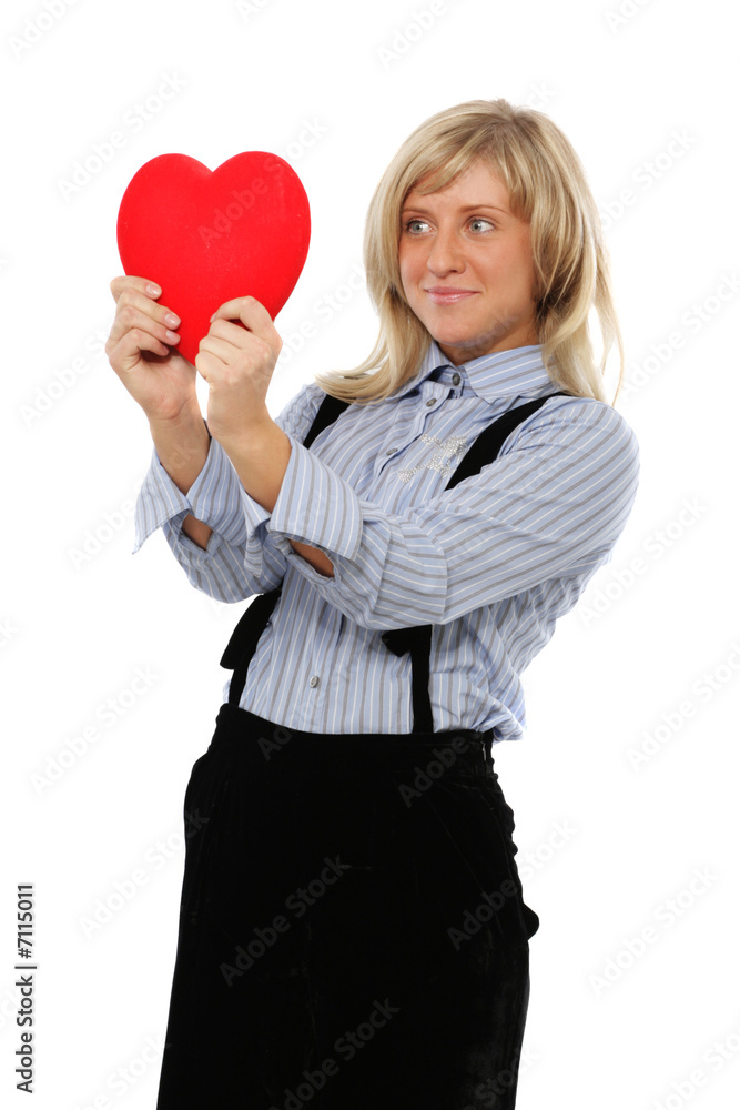 The girl the blonde holds velvet heart in hands The girl the blonde holds velvet heart in hands