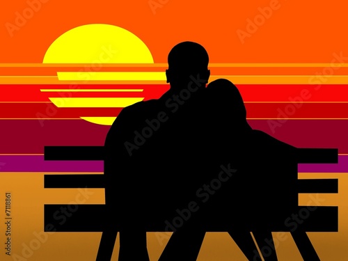 Lovers on the beach at sunset