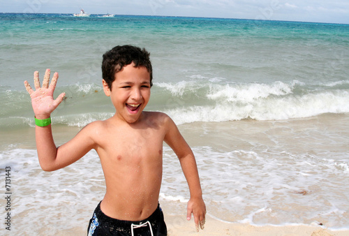 Boy Playing At Beach