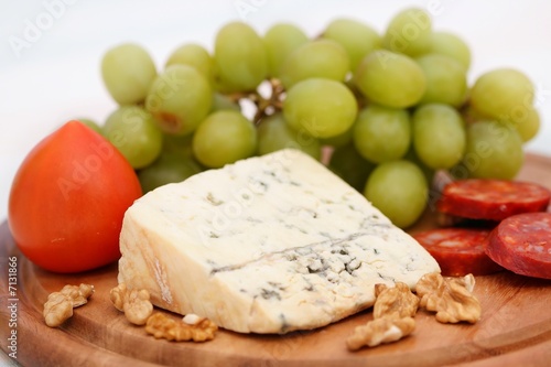 Grape, cheese with nuts and sausage
