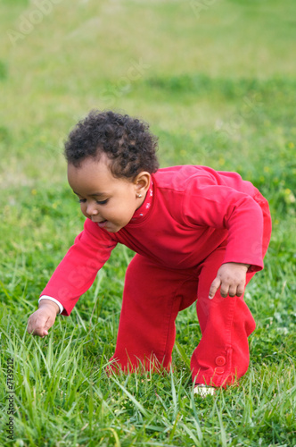 Baby playing on the grass