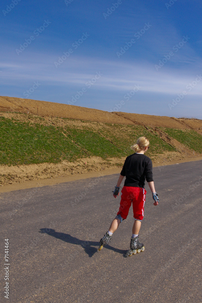 Fototapeta premium young woman on rollerskates