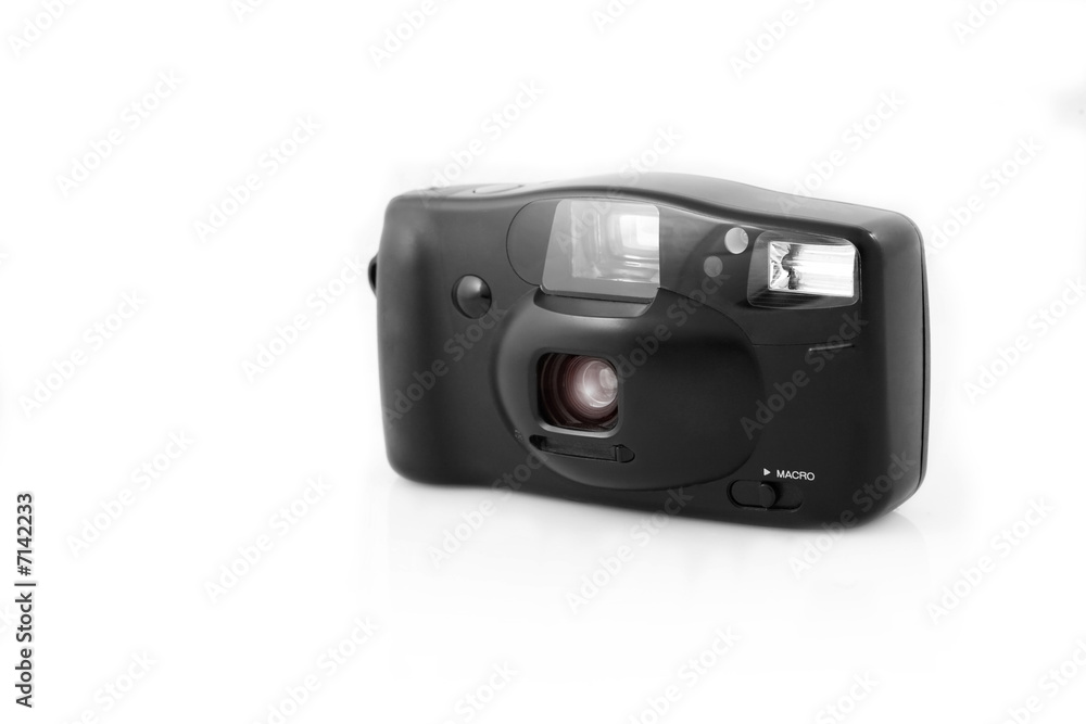 Old compact film camera, isolated on white Old compact film camera, isolated on white