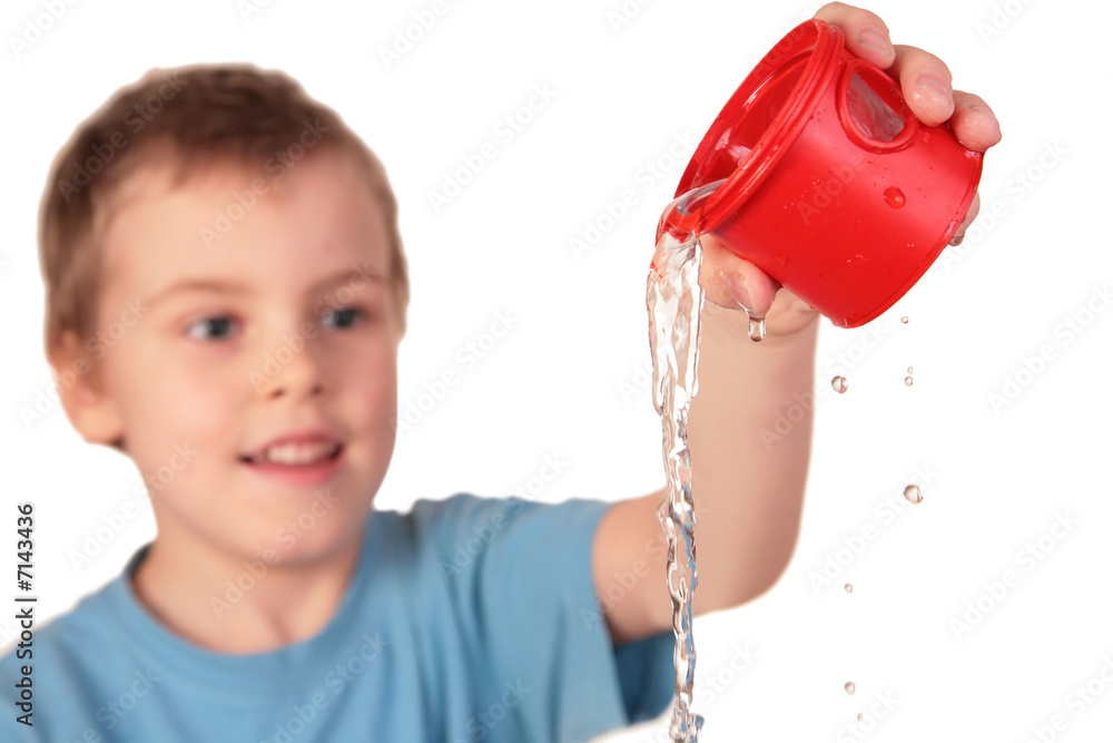 © Pavel Losevsky - boy pours out water from red plastic cup © Pavel Losevsky - boy pours out water from red plastic cup