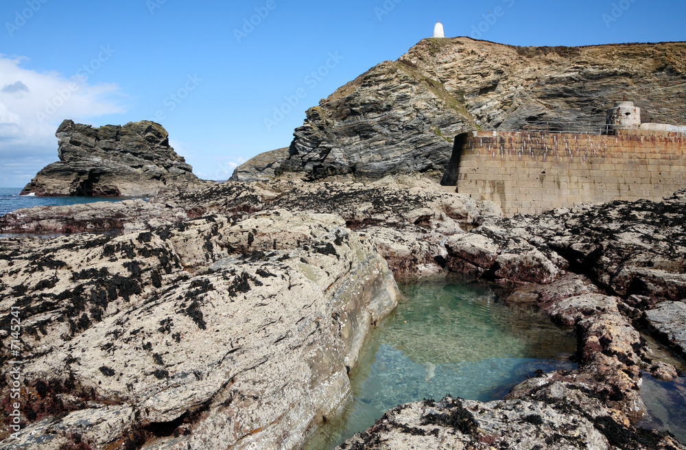 A natural rock pool at low tide in Porteath, Cornwall UK.