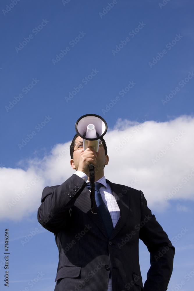 Businessman speaking with a megaphone Businessman speaking with a megaphone