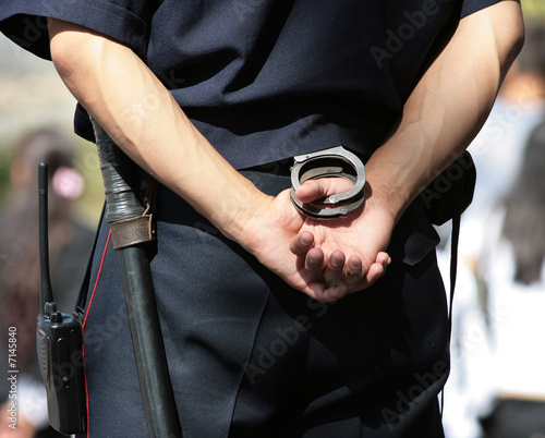 Policeman with handcuffs photo