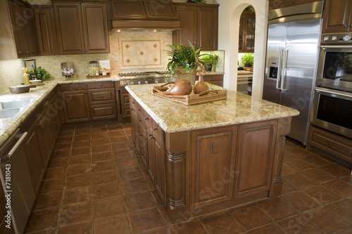 Modern Kitchen with brown tiles.