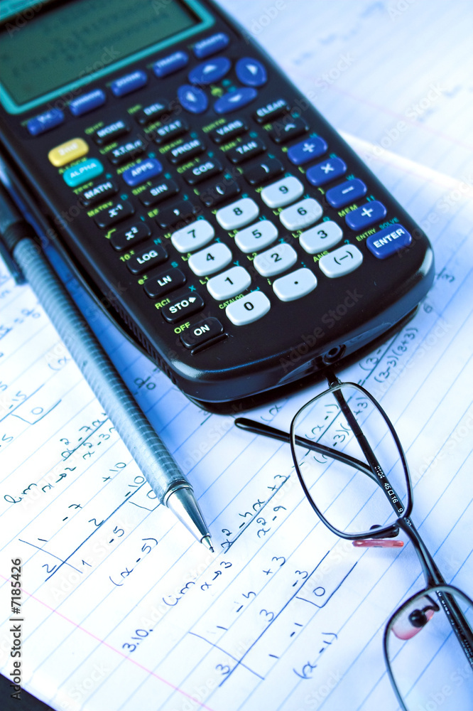 Scientific Calculator with exercise books and glasses Scientific Calculator with exercise books and glasses