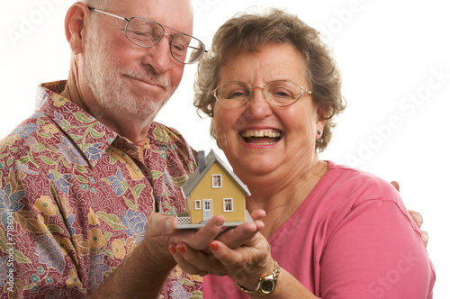 Happy Senior Couple & House