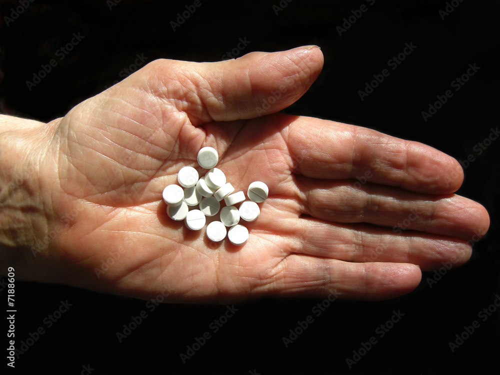 Hand with pills Hand with pills