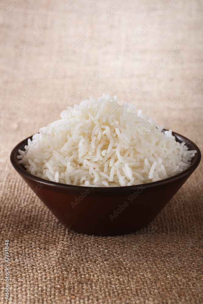 plain white rice bowl on brown rustic background plain white rice bowl on brown rustic background
