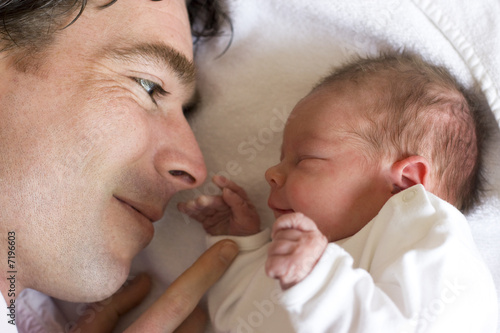 father and his newborn daughter, a couple of hours old