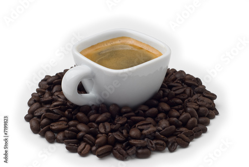 Espresso cup with coffee beans isolated on white