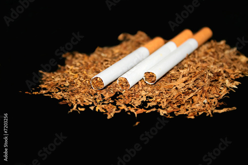 Three cigarettes on a black background