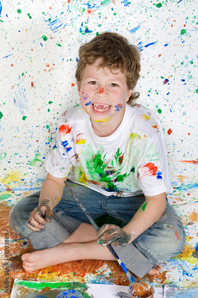 Fototapeta premium Boy playing with painting