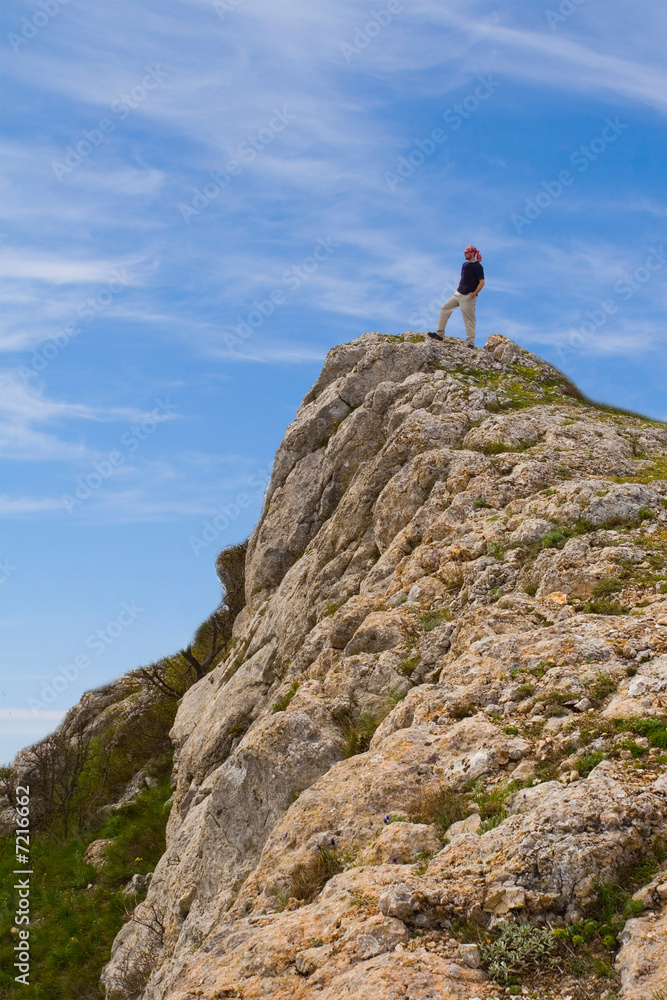 Active people - Person climbing a cliff Active people - Person climbing a cliff