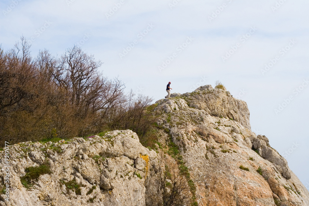 Active people - Person climbing a cliff
