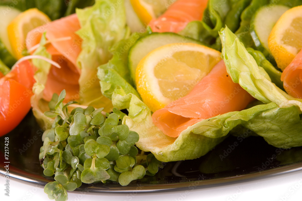 Smoked Salmon Salad - close up on black plate Smoked Salmon Salad - close up on black plate