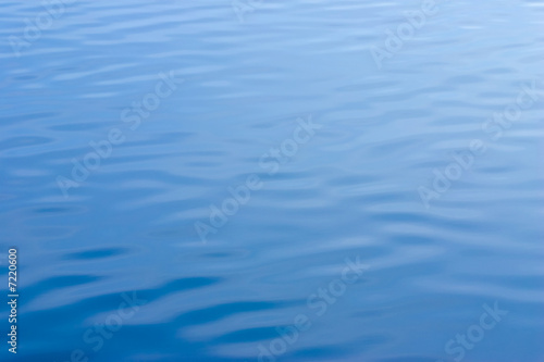 Blue water with ripples reflecting blue sky