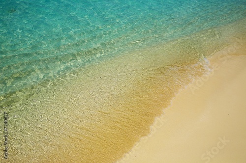 Blue water ripples near the shore photo