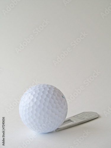Golf ball and repair tool