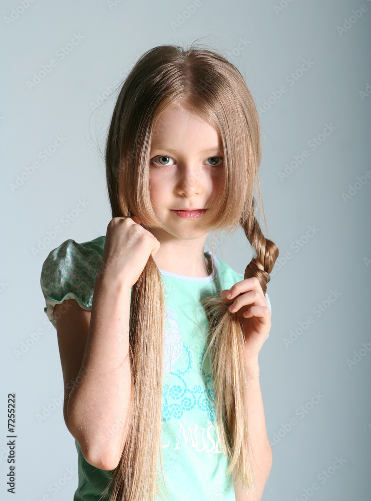 little girl depicts a robot. child poses in the studio and makes movements  with his hands and feet. kids fashion Stock Photo - Alamy