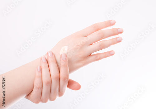 woman applying cream to her hands