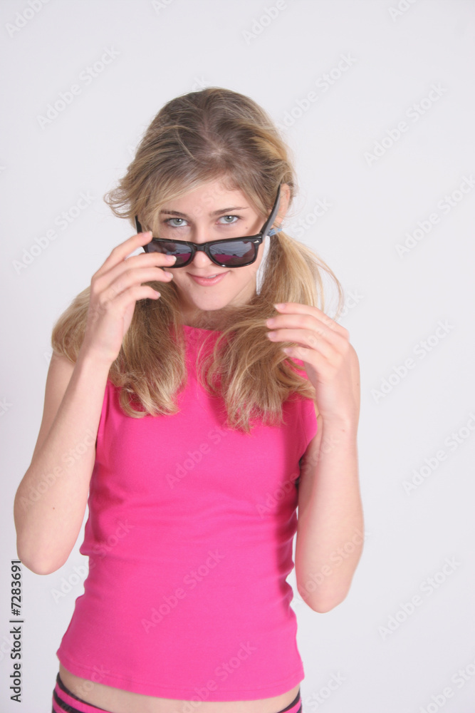 Pretty blond looking over glasses Pretty blond looking over glasses