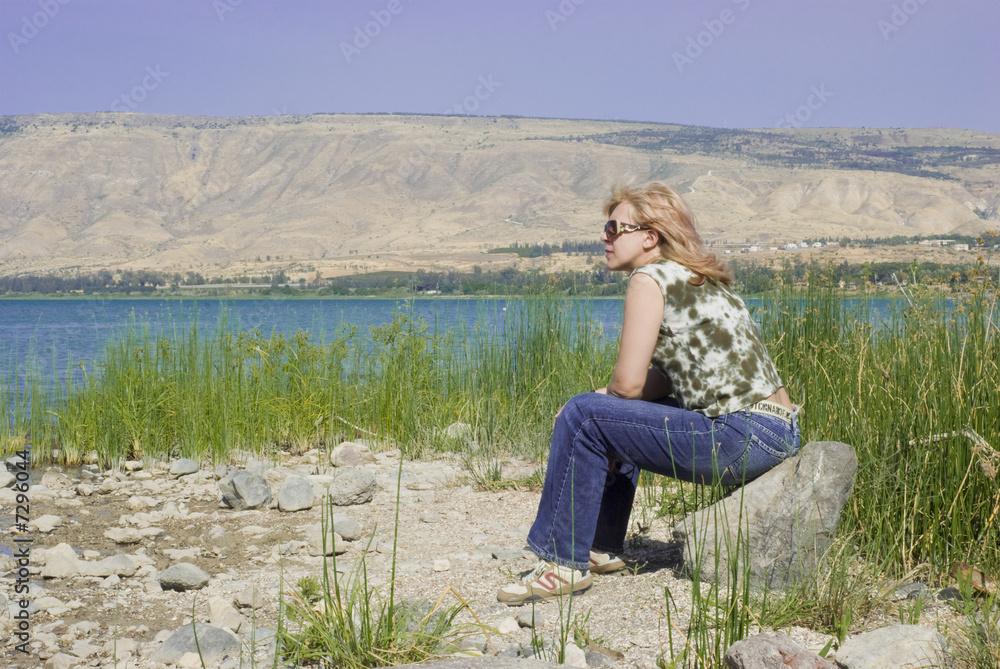 Woman on beach of the lake