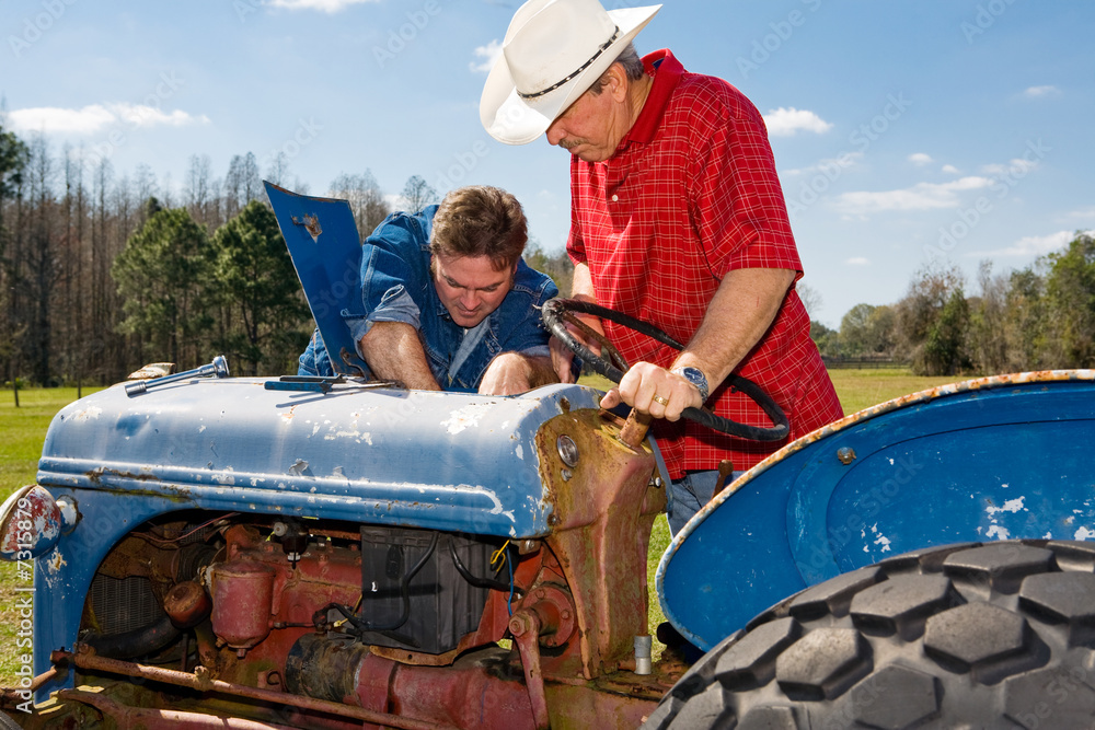 Obraz premium Repairing the Old Tractor