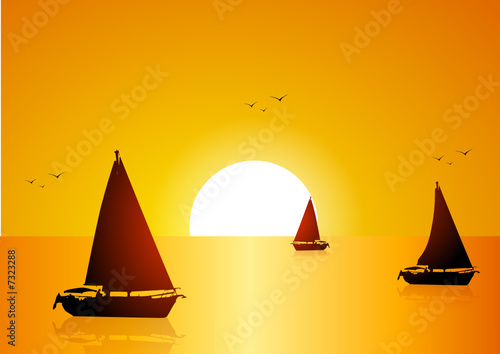 Boats in the sea at sunset