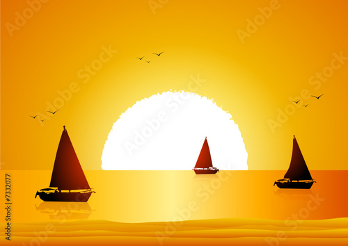 Boats in the sea at sunset