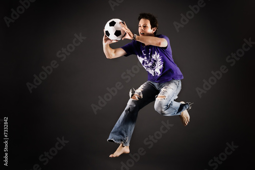 Bilde på lerret Soccer playing catching a ball