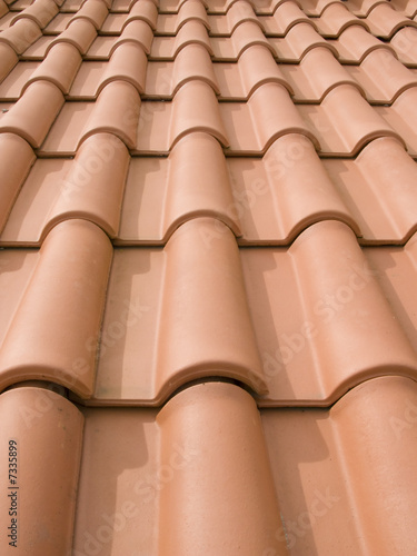 New orange roof tiles close up detail