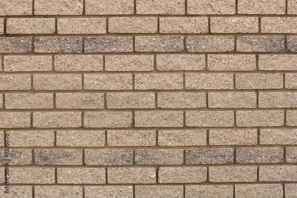 Fototapeta premium The patterns created by the bricks in a facebrick wall