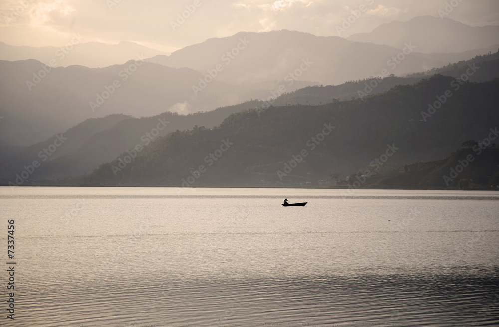 boat on fewa lake at sunset, pokhara, nepal