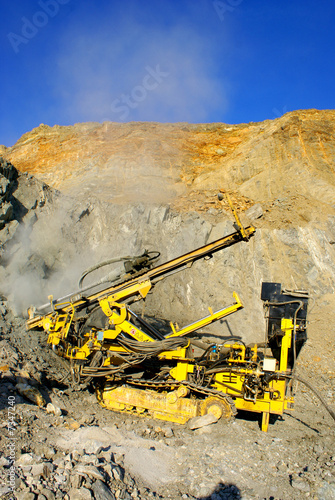Drill machine in open pit