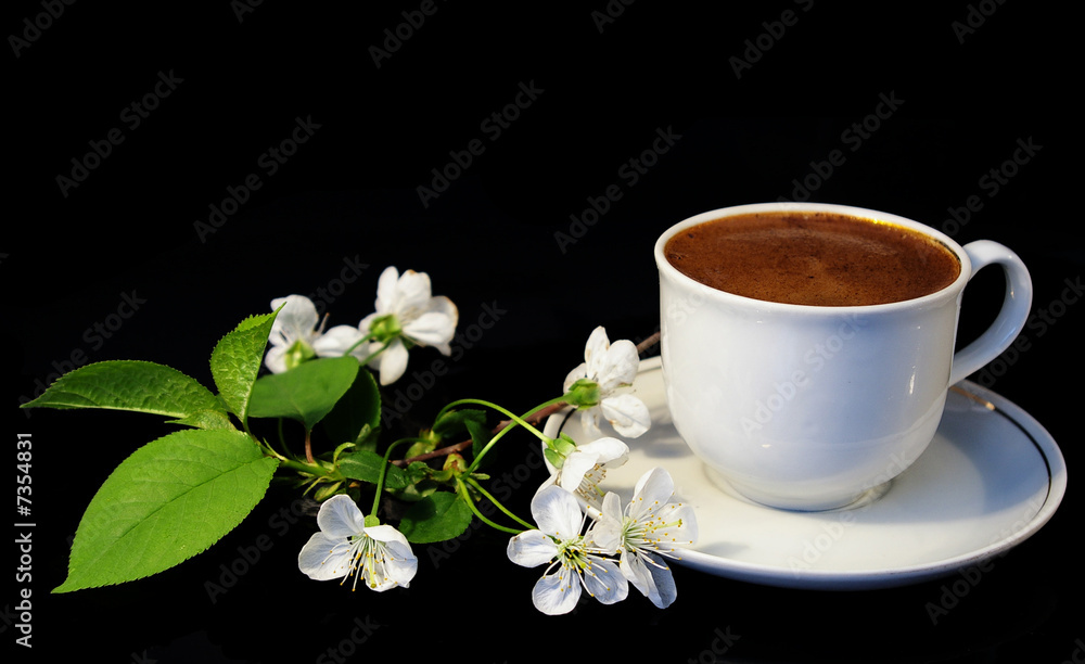 Flowers and white cup of coffee Flowers and white cup of coffee